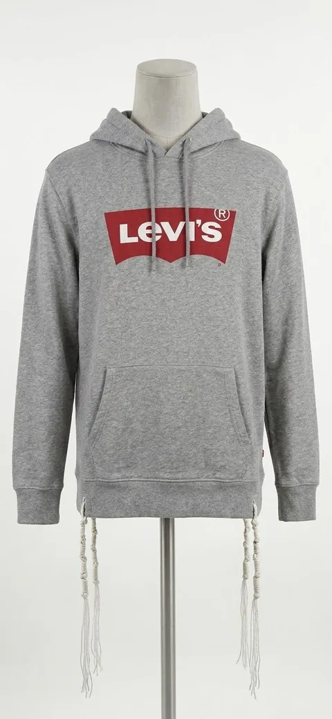 Piece 1: tzitzit tied into a Levi's hoodie, heather grey, on a mannequin