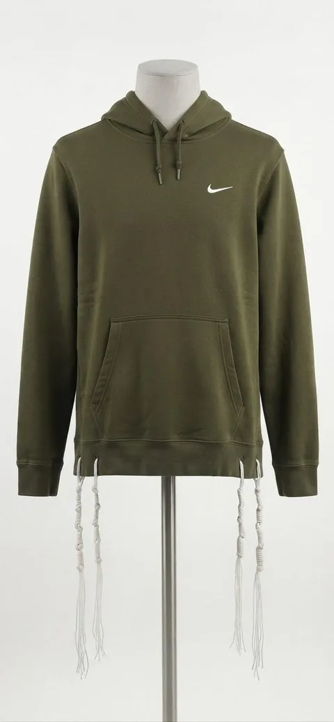 Piece 8: tzitzit tied into a Nike hoodie, olive, on a mannequin