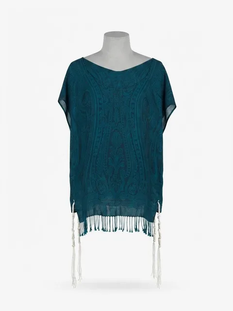 Piece 12: tzitzit tied into a teal paisley cloth, on a mannequin