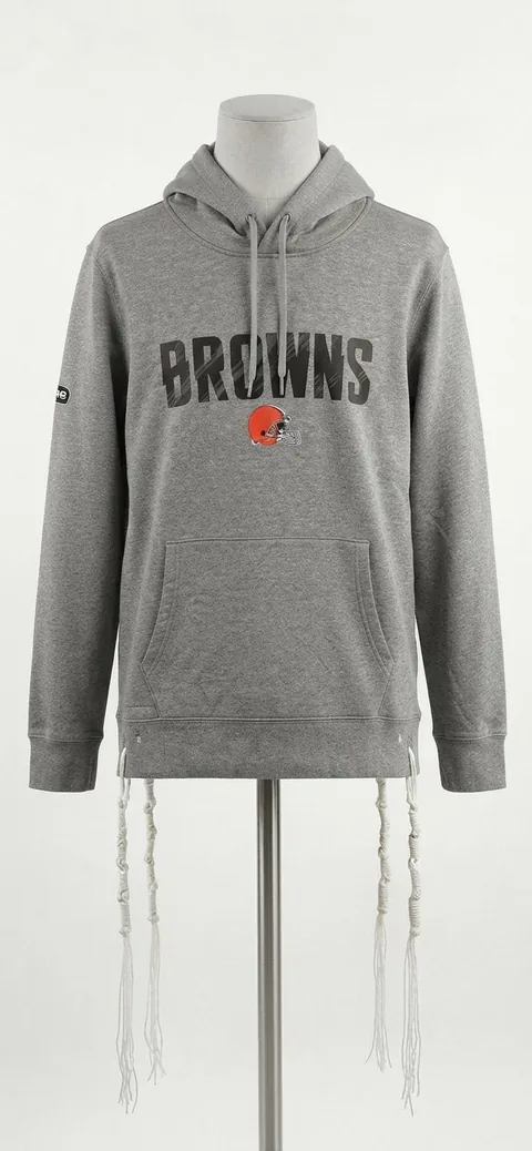 Piece 17: tzitzit tied into a Cleveland Browns hoodie, on a mannequin