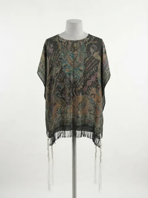 Piece 19: tzitzit tied into a floral paisley cloth on charcoal, on a mannequin