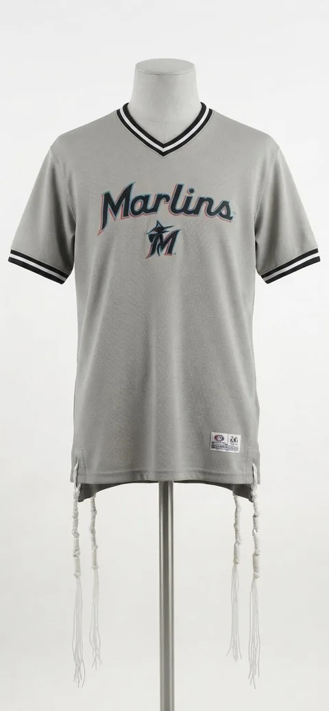 Piece 21: tzitzit tied into a Miami Marlins jersey, on a mannequin
