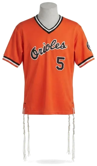 Piece 30: tzitzit tied into a Baltimore Orioles jersey, number 5, on a mannequin